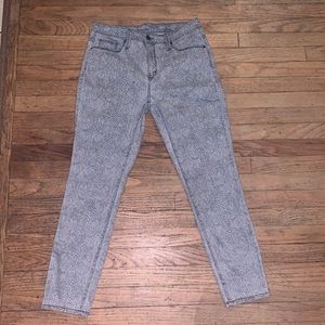 Universal thread brand faded snakeskin print jeans.